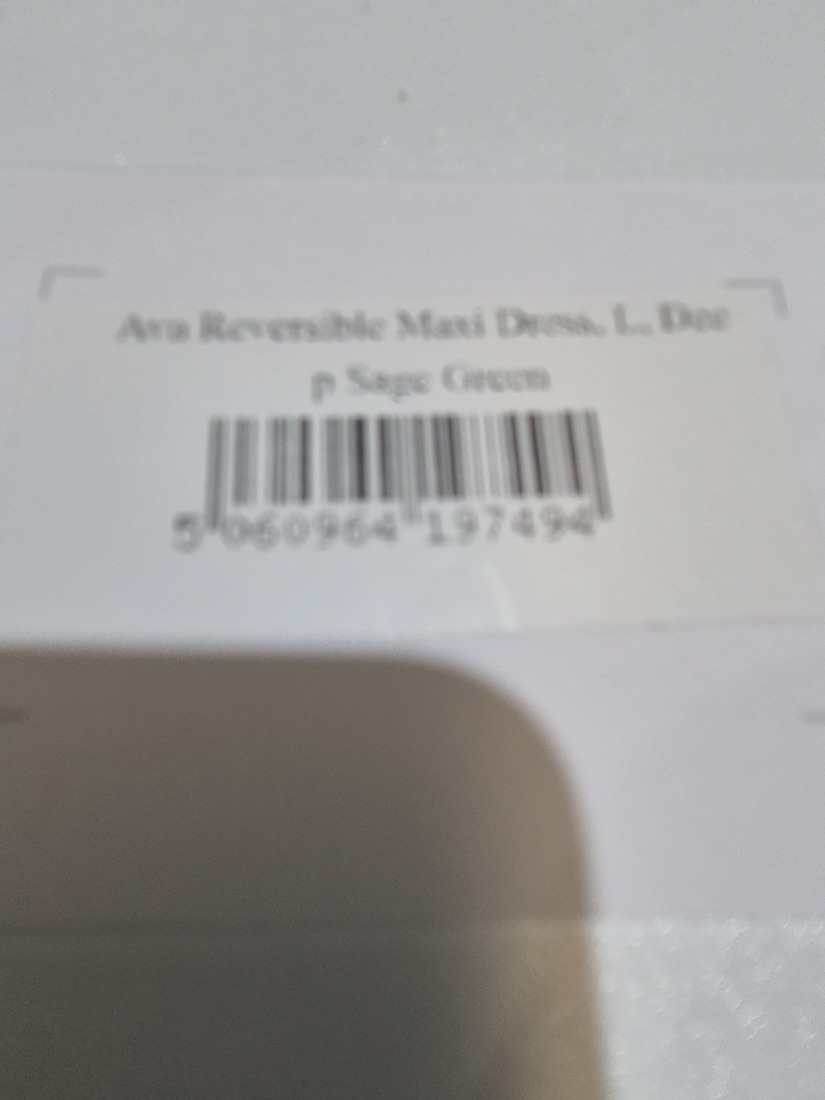 The dress's real swing tag, as the warehouse phone sees it